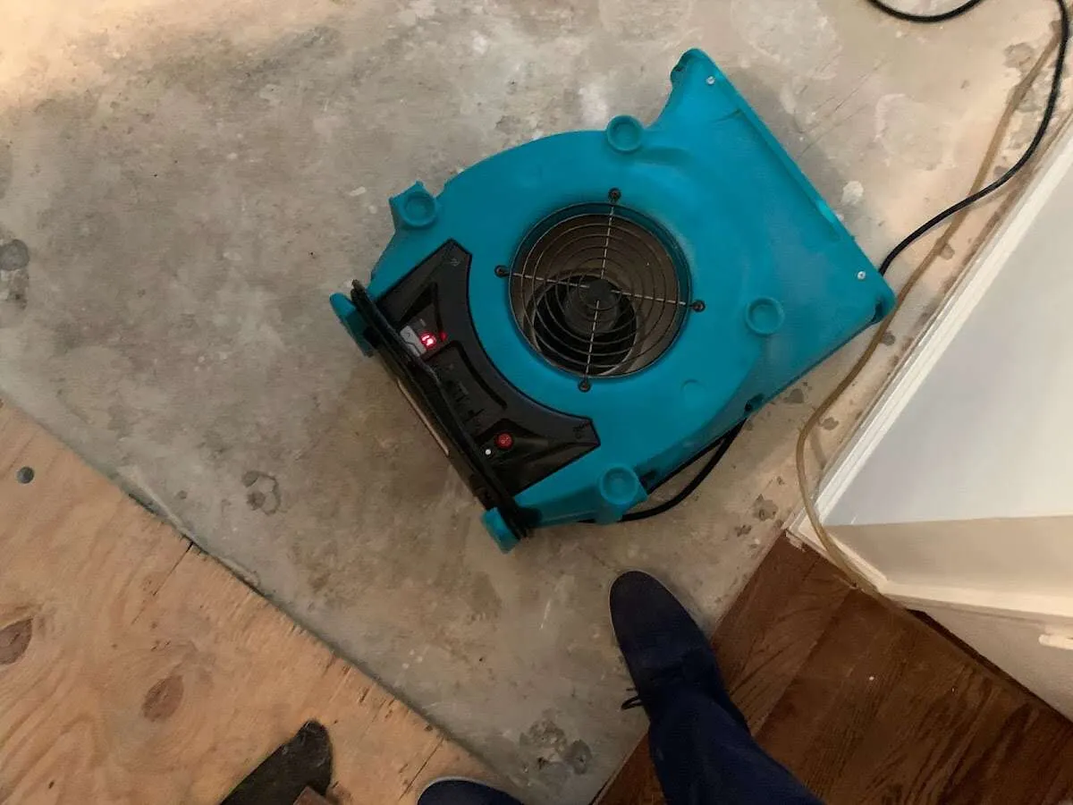 Air mover drying subfloor during Leak Detection & Repair in Chillicothe